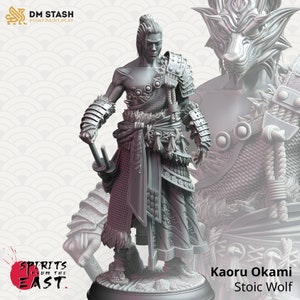 May include: A detailed gray figurine of a warrior, holding two swords, with intricate armor and a fur-like garment. The figure is labeled "Kaoru Okami Stoic Wolf" and is part of the "Spirits from the East" collection. The DM STASH logo is visible.