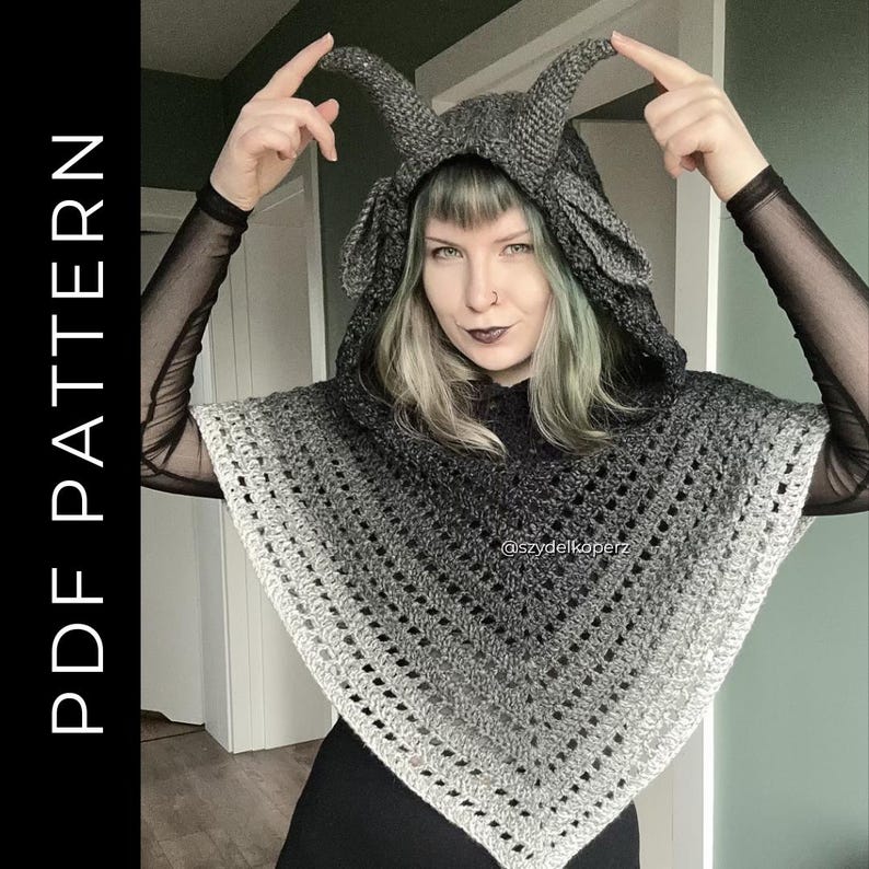 May include: A gray crocheted hooded poncho featuring two prominent horns on the hood and a gradient color pattern transitioning from dark charcoal at the top to a lighter gray at the bottom hem. The text PDF PATTERN is visible on the left side.