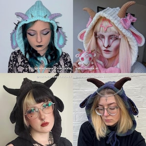 May include: Four crochet goat-horned hoods in various colors. The hoods feature horns, ear details, and some have spikes or decorative chains. The colors include blue, white, black, and a plaid pattern. The hoods are worn by people.