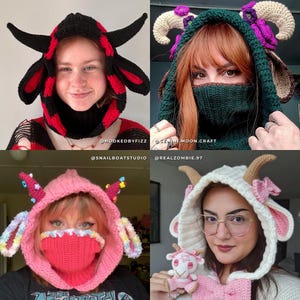 May include: Four crochet goat-themed hoods in various colors. One is black and red, another is green with purple accents, a third is pink with rainbow details, and the last is white and pink.