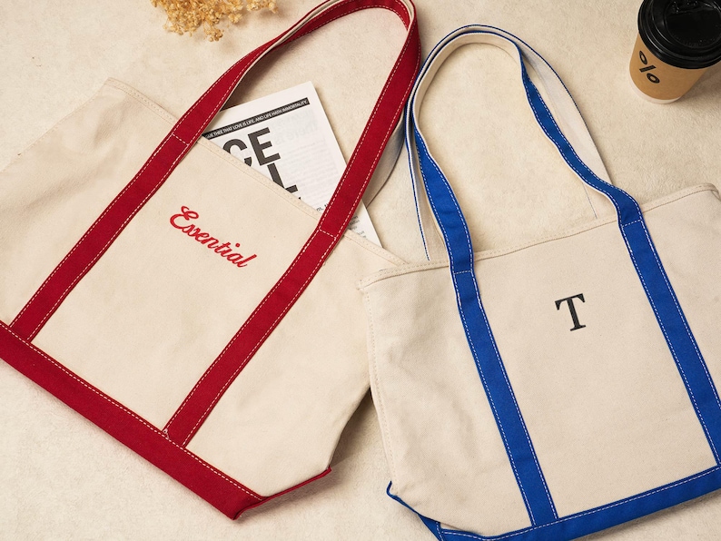 May include: A set of three ceramic mugs with a speckled, matte finish. Each mug features a different color: light blue, cream, and gray. The mugs have a simple, modern design and a comfortable handle.