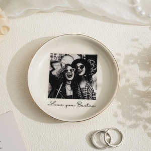 May include: A white ceramic mug with a black handle and the text "But First, Coffee" in a handwritten style. The mug is likely 11-15 ounces, perfect for a morning beverage.