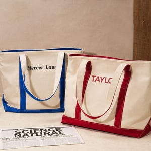 May include: A set of three ceramic mugs with a speckled, matte finish. The mugs are in shades of cream, light gray, and dark gray. Each mug has a simple, minimalist design and a rounded handle.