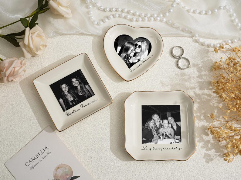 May include: Three decorative ceramic trays with gold trim, each featuring a black and white photograph. One is heart-shaped, one square, and one scalloped. Text on the trays reads "Bestie Forever," "Friends Forever," and "Long live friendship."