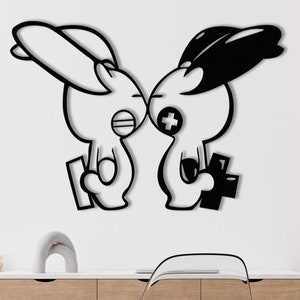 Könnte beinhalten: Schwarz-weiße Wandkunst mit zwei Cartoon-Hasenfiguren in einer spielerischen Pose. Ein Hase ist weiß mit schwarzer Umrandung, der andere ist schwarz mit weißer Umrandung. Jeder Hase hält einen Controller.