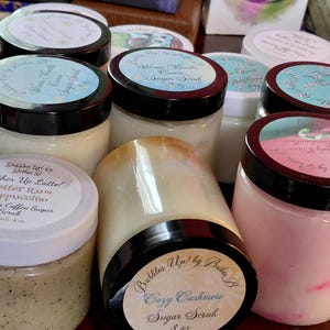 May include: A rustic wooden sign with the text "Welcome to our home" in white lettering. The sign features a distressed finish and a simple, inviting design, perfect for entryway decor.