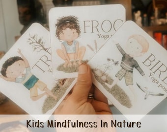 May include: A hand holding three square yoga flashcards with illustrations of children in yoga poses. The cards are labeled "Frog", "Bird", and "Tree". The text at the bottom reads "Kids Mindfulness In Nature" and "Yoga Flashcards & Mindfulness Breathing Exercises & Mindfulness Journal."
