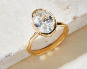 2.00 Carat Oval Lab-Grown Diamond Engagement Ring: 14k Yellow Gold Bezel Setting, IGI Certified