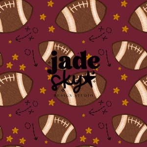 May include: A seamless pattern featuring brown and white footballs, gold stars, and black and white football play diagrams on a maroon background. The text "jade sky design studio" is centered on the pattern.