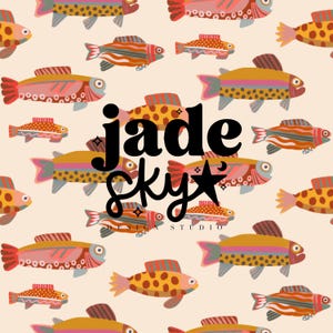 May include: A seamless pattern featuring colorful fish with geometric patterns on a cream background. The text "jade sky design studio" is centered in the pattern.