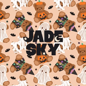 May include: A repeating pattern on a light peach background featuring brown teddy bears dressed in Halloween costumes including pumpkins, ghosts, and witch hats, with small black bats and stars. The text JADE & SKY is centered in black.
