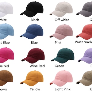 May include: A collection of baseball caps in various colors, including white, black, light blue, pink, and brown. Each cap has a curved brim and a fabric strap closure. The image displays the color names: white, black, off white, gray, light blue, blue, pink, watermelon red, rose red, wine red, green, purple, brown, yellow, light pink, and khaki.