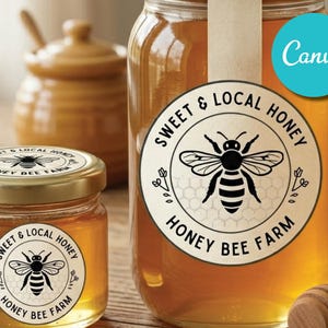 May include: Glass jars filled with golden honey, labeled with a circular design featuring a bee and the text "Sweet & Local Honey, Honey Bee Farm." A small wooden honey dipper is visible. The image also includes a small honey pot.