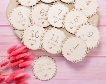 Set of personalized wooden heart-shaped milestone cards with birth names
