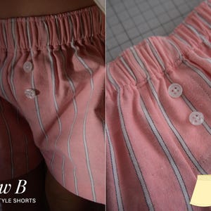 May include: Pink boxer-style shorts featuring a vertical white and dark stripe pattern, an elasticized waistband, and a front placket with two white buttons. The image includes the text View B BOXER STYLE SHORTS and a yellow graphic illustration.