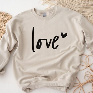 a sweater with the word love printed on it