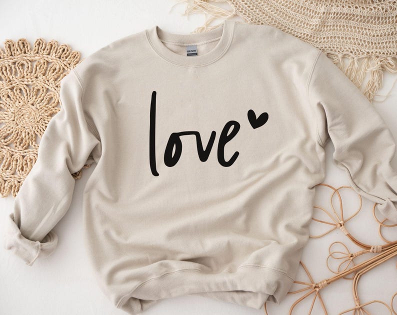 a sweater with the word love printed on it