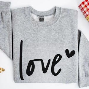 a sweater with the word love written on it