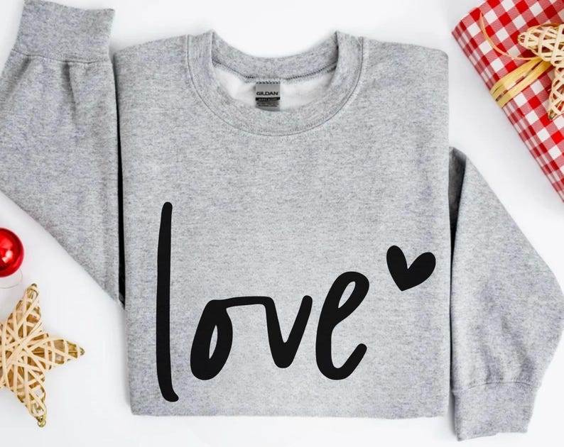 a sweater with the word love written on it