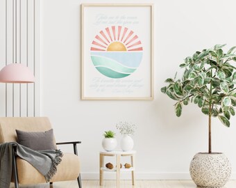 May include: A watercolor print with a sunset over the ocean. The print features a quote: "Take me to the ocean, let me sail the open sea." The quote is attributed to "Unknown".