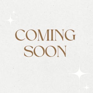 May include: A light beige background with the words "COMING SOON" in a warm brown colour. The text is centred and has a classic serif font. White starburst graphics are in the corners.