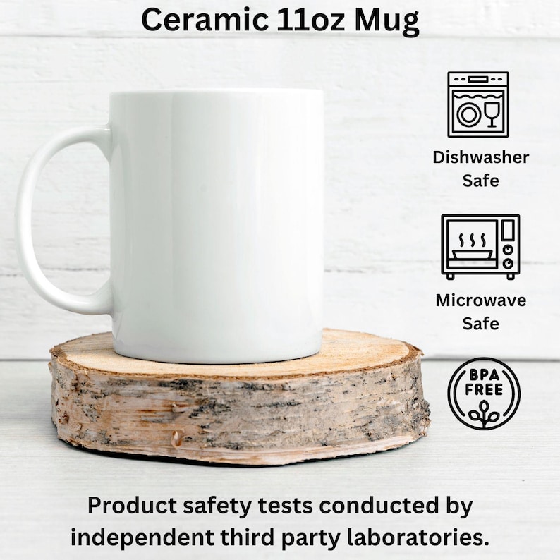 May include: A white ceramic 11oz mug with a handle, placed on a wooden slice. The mug is labelled as dishwasher and microwave safe, and BPA free. The text at the top says "Ceramic 11oz Mug".