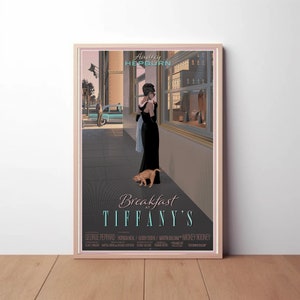 May include: A vintage movie poster for the film "Breakfast at Tiffany's" featuring Audrey Hepburn in a black dress and a small orange cat. The poster has a gray background with a cityscape in the background.