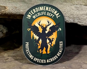 May include: An oval sticker with the text "INTERDIMENSIONAL WILDLIFE DEPT." above a silhouette of a deer-like creature with wings. The text "PROTECTING SPECIES ACROSS REALITIES" curves around the bottom. The background is dark green with a yellow sun.