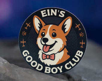 May include: A round sticker featuring a cartoon corgi dog with a red bow tie and its tongue sticking out. The sticker has the text "EIN'S GOOD BOY CLUB" in white lettering around the dog's image. The background is a gradient of blue and purple.