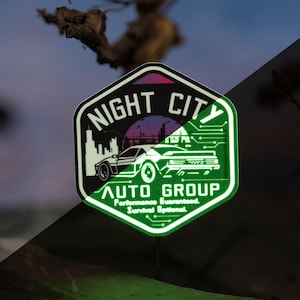 Night City Auto Group – Retro Cyberpunk Car Culture Glow-in-the-Dark Vinyl Sticker | Sci-Fi Fan Art Decal