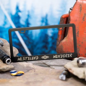 Wasteland Wanderer - Nuclear Fallout - wastelander METAL Laser Etched License Plate Frame.