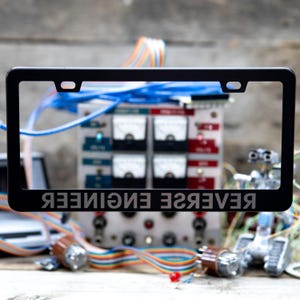 Reverse Engineer | Reversed Text Engraved Metal License Plate Frame – For Innovators & Problem Solvers