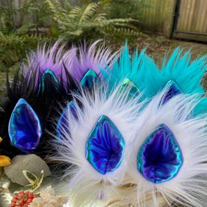 Iridescent Creature Clip on Ears