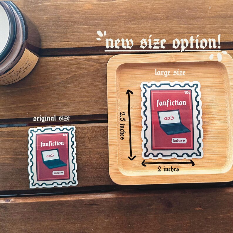 May include: Two sticker designs of a laptop with the text "fanfiction" and "a03" on a red background. The smaller sticker is 2 inches by 2.5 inches and the larger sticker is 2 inches by 2.5 inches.