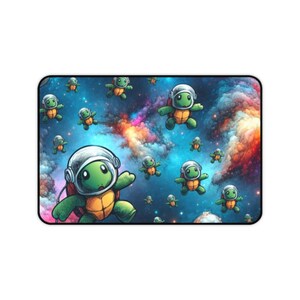 May include: A rectangular mousepad featuring a whimsical illustration of green turtles in astronaut helmets floating in a colorful nebula. The turtles have orange shells and are set against a blue and purple space background.