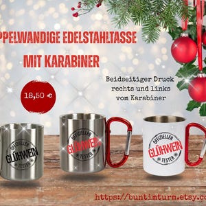 Könnte beinhalten: Edelstahlbecher mit Karabinergriffen, mit dem Text "OFFIZIELLER GLÜHWEIN TESTER". Die Becher sind silber und weiß, mit roten Karabinergriffen. Das Bild enthält auch Text auf Deutsch.