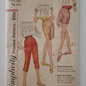May include: A vintage sewing pattern for women's pants, Simplicity pattern number 3435. The pattern includes three different lengths: short, medium, and tall. The pattern is printed on a light brown paper with a black and white illustration of the pants.