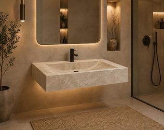 May include: A wall-mounted rectangular bathroom sink crafted from beige natural stone with a textured finish. The basin features a central drain and is paired with a matte black faucet. The unit is illuminated by integrated warm LED lighting.