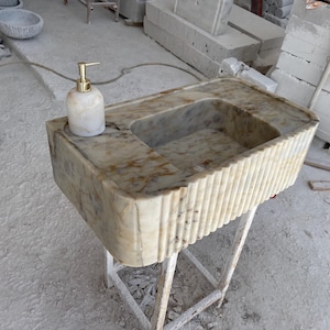 calacatta gold marble sink, gold sink with grooved front, bathroom sink, wall mount marble sink, powder room sink
