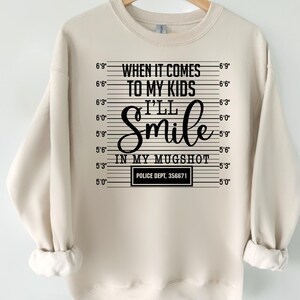 I’ll Smile in My Mugshot Shirt | Funny Protective Mom T-Shirt | Mom Life Quote Tee | Cute Mama Sweat-shirte | Christmas & Halloween Gift Tee