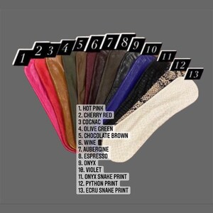 May include: A numbered chart showing 13 different colors and patterns of leather. The colors include hot pink, cherry red, cognac, olive green, chocolate brown, wine, aubergine, espresso, onyx, violet, onyx snake print, python print, and ecru snake print.