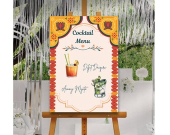 May include: A cocktail menu sign with a yellow, orange, and red floral design. The sign lists two cocktails: "Dift Daiquiri" and "Ammy Mojito".