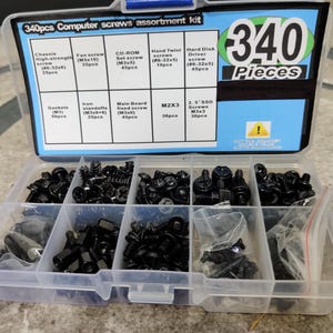 May include: A clear plastic storage box with a blue lid containing 340 pieces of assorted black computer screws. The lid has a label that reads "340pcs Computer screws assortment kit" and lists the different types of screws included.