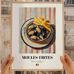 May include: A framed print featuring a colorful illustration of Moules-Frites, a Belgian dish of mussels and french fries. The mussels are in a metal bowl with fries. The text "MOULES-FRITES" is at the bottom, with "Made in Belgium" below it.