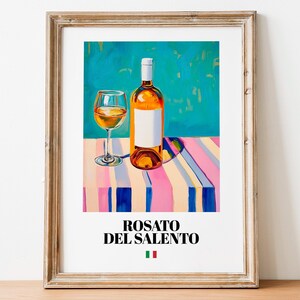 May include: A painting of a bottle of Rosato del Salento wine with a glass of wine on a striped tablecloth. The background is a turquoise blue.