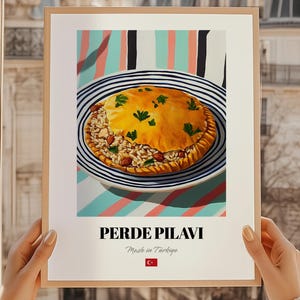 May include: A framed print featuring a vibrant illustration of Perde Pilavi, a Turkish dish. The dish is presented on a blue and white striped plate against a colorful striped background. The print includes the text "PERDE PILAVI" and "Made in Türkiye".