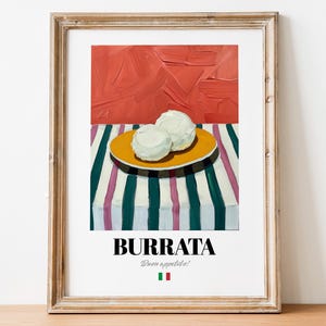 May include: A framed print of a painting depicting a plate of white burrata cheese on a striped tablecloth. The text "Burrata" and "Buon appetito!" is printed below the image, along with a small Italian flag.