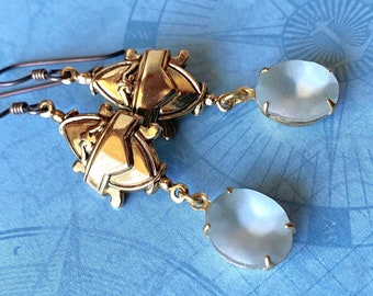 Art Deco dangle earrings with pale blue matte glass drops