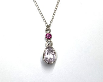 Pear shaped pink Kunzite necklace pendant with pink faceted, Garnet set bail, in Sterling Silver with lobster clasp Sterling Silver chain