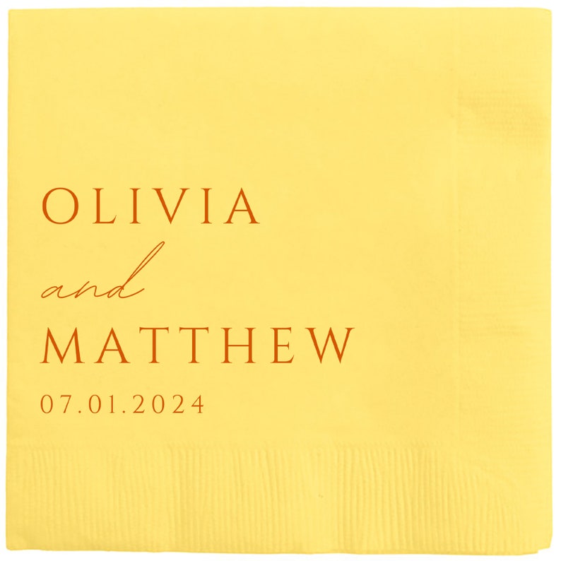 May include: Yellow paper napkin with the text "OLIVIA and MATTHEW 07.01.2024" printed in orange.